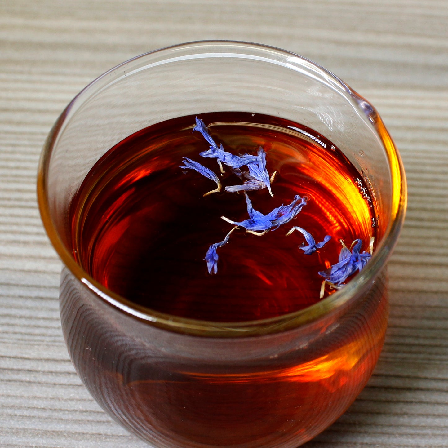 Blue Flower Earl Grey - infusion in glass cup. Tasting Notes:
caramel • cedar • candied lemon