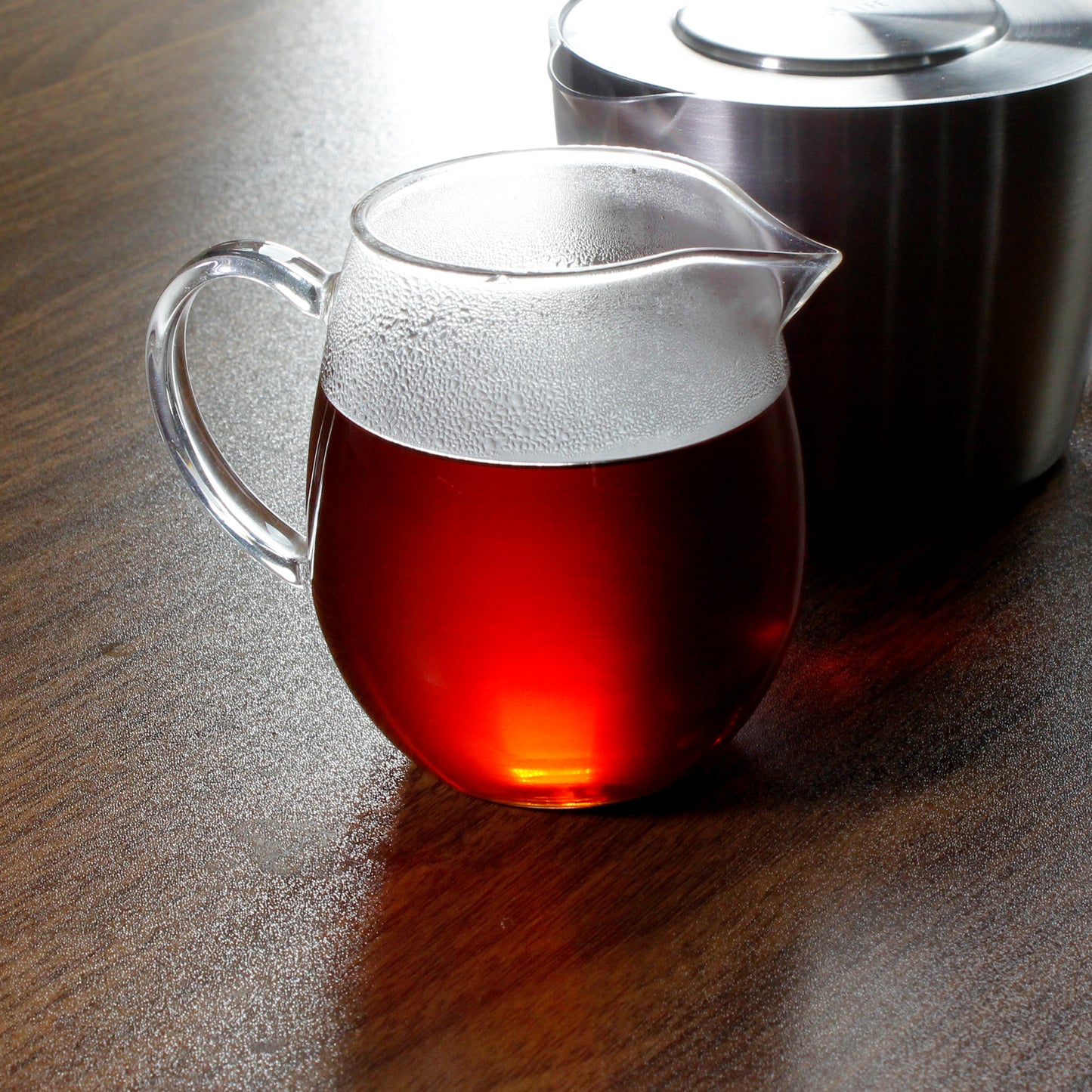 Cederberg Cinnamon - infusion in a glass pitcher on a dark table. Tasting Notes: cinnamon • clove • vanilla