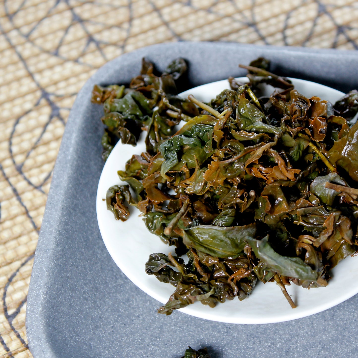 Gui Fei - wet leaves on a white dish. Tasting Notes:
cracked wheat • cinnamon • apple