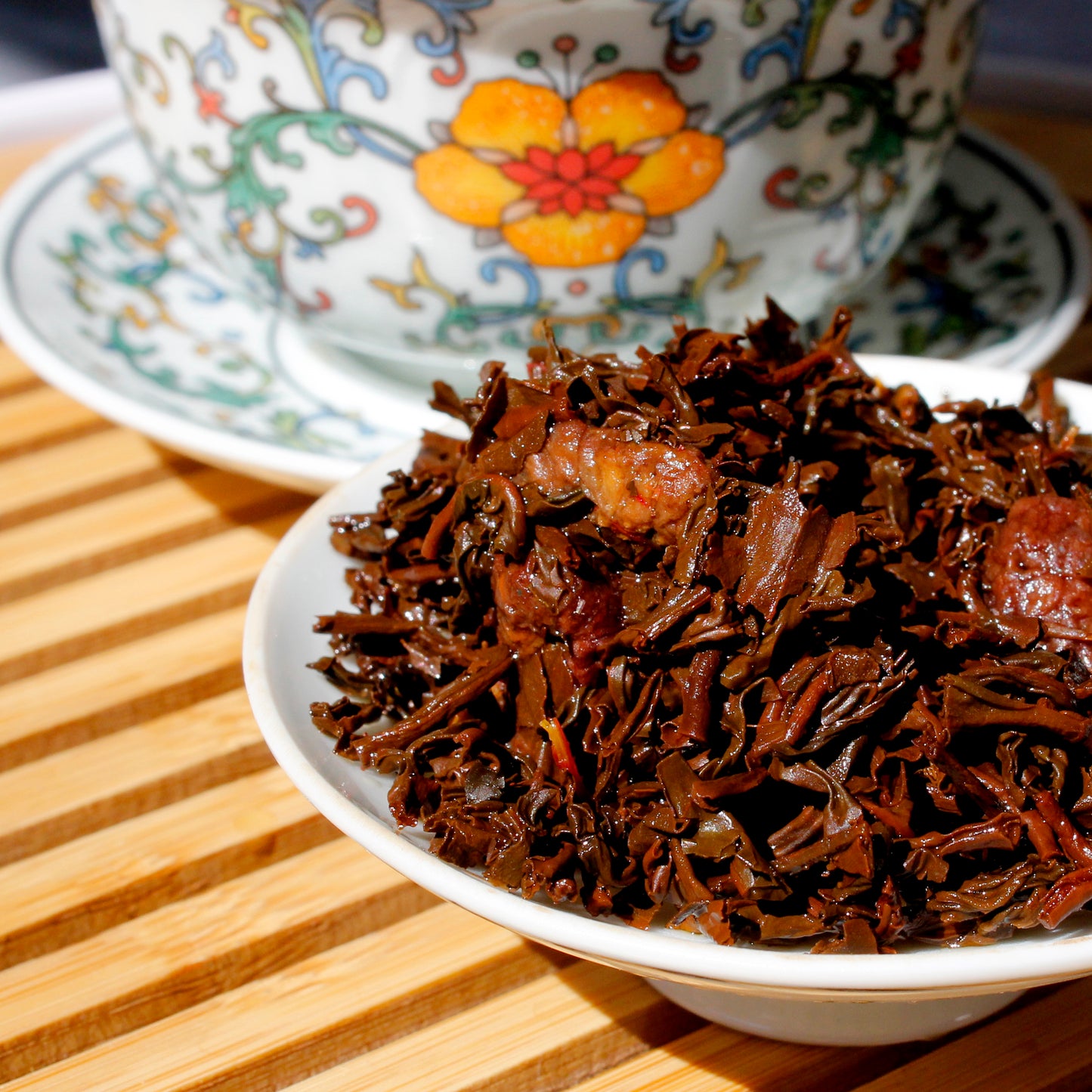 Raspberry - wet leaves on a white dish with printed Gawain in the background. Tasting Notes:
raspberry • black cherry • lemon