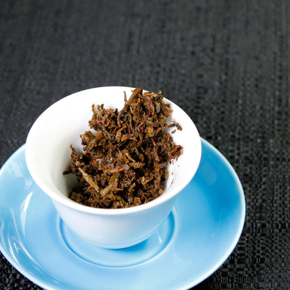 Lincang Half Dollar: 2011 Sheng Pu-Erh - wet leaves