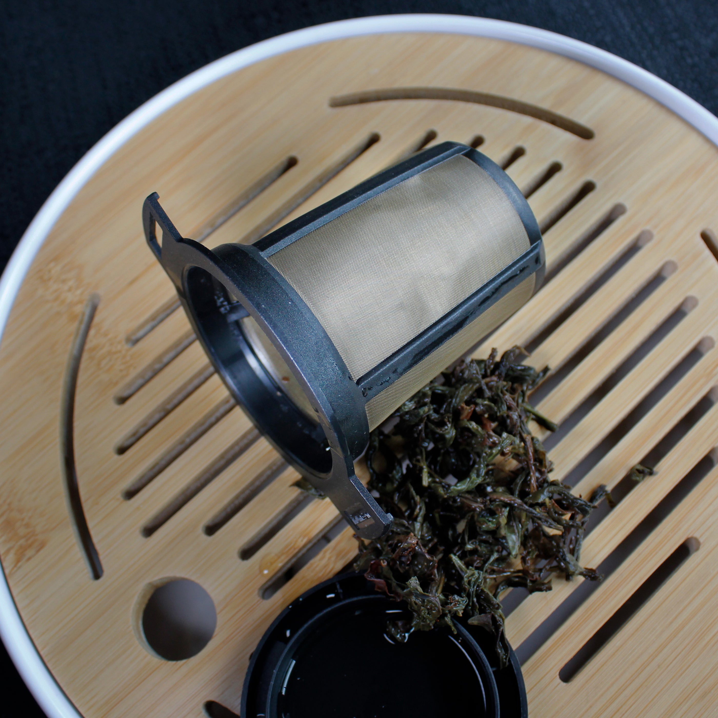 Black & Gold Strainer/Infuser - strainer on a tea tray