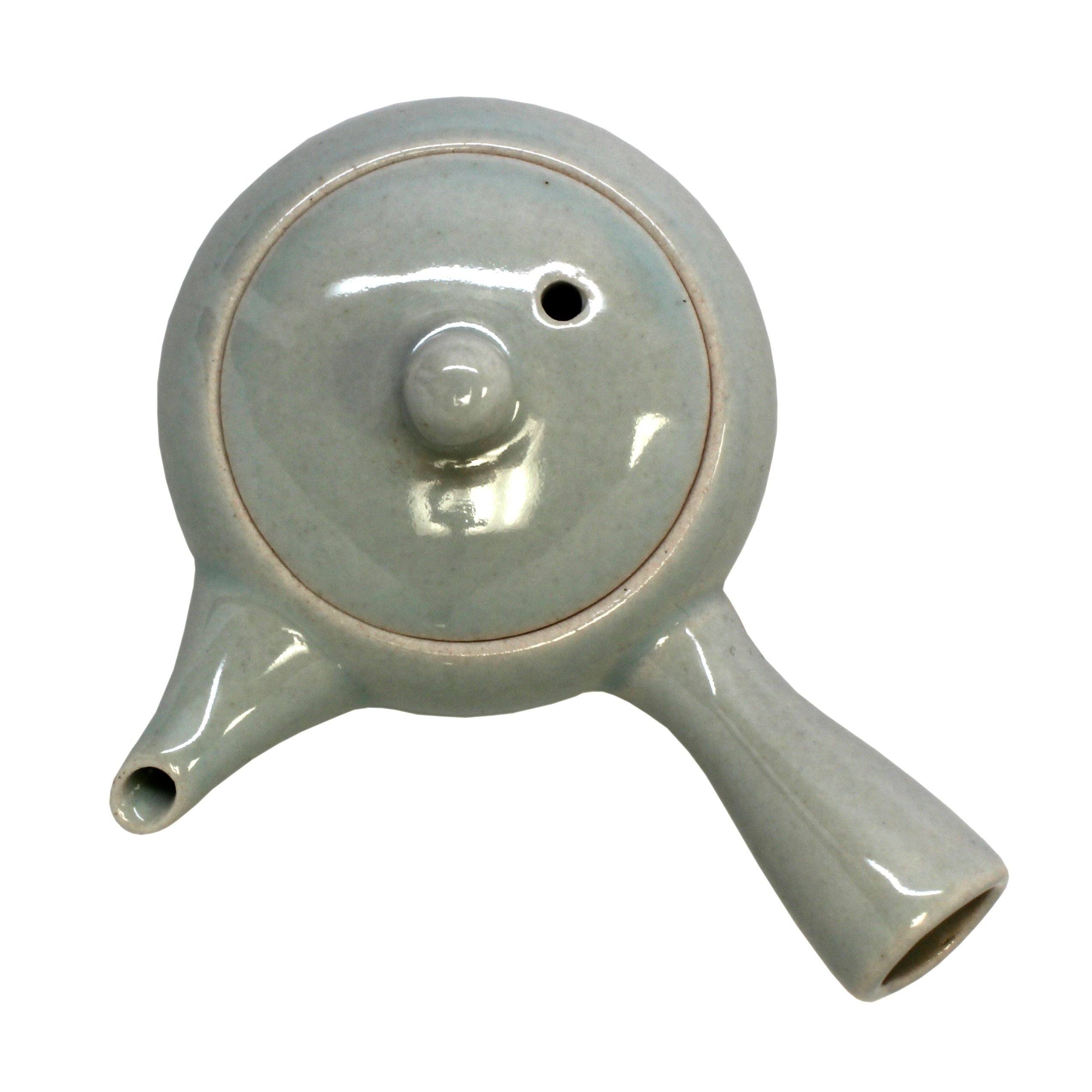 Off white tea pot with lid on it.