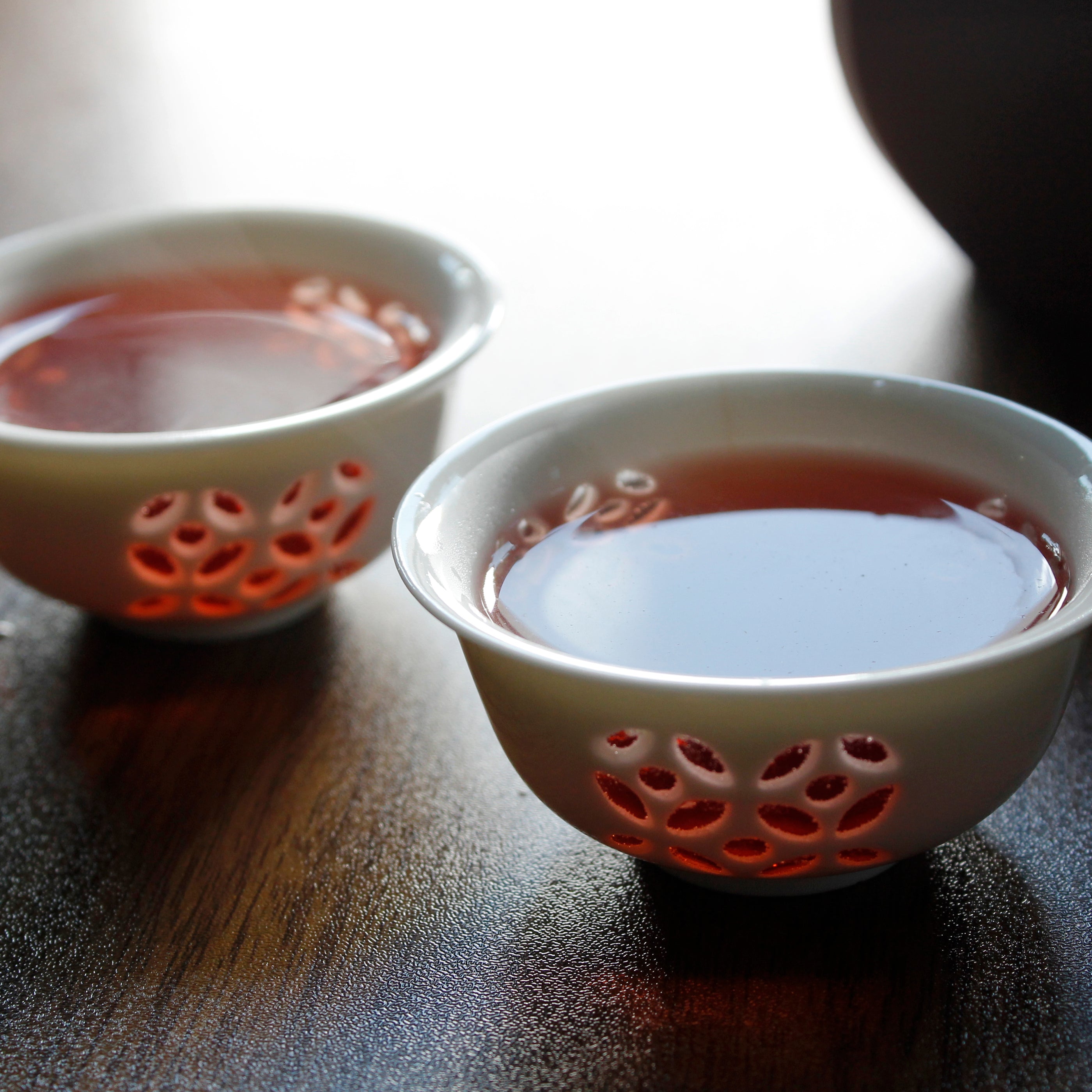 Blood Orange Hibiscus - infusion in two small tea cups. Tasting Notes:
orange peel • pomegranate • lemon